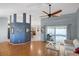 Open-concept living room with hardwood floors and sliding doors to the pool area at 803 Diane Cir, Englewood, FL 34223