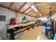 Well-organized shed interior featuring workbench, pegboard, and ample storage at 803 Diane Cir, Englewood, FL 34223