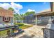 Spacious backyard featuring a shed, grill area, and a screened-in pool enclosure at 8205 Chico St, Port Charlotte, FL 33981