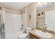 Standard bathroom with shower/tub combination, granite counters, and neutral color palette at 8205 Chico St, Port Charlotte, FL 33981