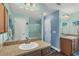 Well-lit bathroom with double vanity and shower at 8205 Chico St, Port Charlotte, FL 33981