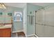 Bathroom with vanity, shower, and beach decor at 8205 Chico St, Port Charlotte, FL 33981