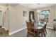 Cozy dining area featuring a wood table with chairs and a decorative hutch at 8205 Chico St, Port Charlotte, FL 33981