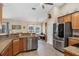 Kitchen boasting stainless steel appliances, granite countertops, and ample cabinet space at 8205 Chico St, Port Charlotte, FL 33981