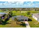 Aerial shot of the home near the golf course and waterway at 84 Caddy Rd, Rotonda West, FL 33947