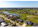 Aerial shot of a home with a pool near lakes and golf courses at 84 Caddy Rd, Rotonda West, FL 33947