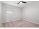 Bedroom featuring neutral carpet, one window with blinds, and a ceiling fan at 84 Caddy Rd, Rotonda West, FL 33947