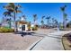 Welcoming resort entrance with security booth, palm trees, and beautiful landscaping at 8403 Placida Rd # 401, Placida, FL 33946