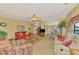 Bright living room open to the kitchen and dining area, filled with natural light at 8431 Nighthawk Dr, Englewood, FL 34224