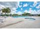 Resort-style pool with plenty of seating and lush landscaping at 8431 Nighthawk Dr, Englewood, FL 34224