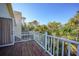 Spacious balcony with serene views and a railing overlooking lush greenery at 955 Morrison Ave, Englewood, FL 34223