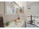 Bright bathroom featuring a single sink vanity and neutral wall colors at 955 Morrison Ave, Englewood, FL 34223