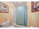 Bathroom featuring a tub and shower combination with a curtain at 955 Morrison Ave, Englewood, FL 34223