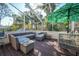 A spacious deck includes a dining area, seating area, and grill area, perfect for entertaining or relaxing at 955 Morrison Ave, Englewood, FL 34223