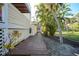 Landscaped home exterior with tropical foliage and inviting walkway at 955 Morrison Ave, Englewood, FL 34223