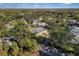 Overhead view of a quiet neighborhood nestled amidst lush greenery and mature trees at 10 Bermuda Cir # 57, Englewood, FL 34223