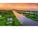 Scenic aerial shot of the coastal waterway bordering the community, highlighting lush greenery and nearby ocean access at 11120 Hacienda Del Mar Blvd # F-301, Placida, FL 33946