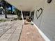 Inviting porch featuring tiled flooring and a cozy seating area at 1115 Gulf Blvd, Englewood, FL 34223