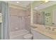 Bathroom includes a tub, shower, and single vanity with recessed lighting at 13241 Scrub Jay Ct, Port Charlotte, FL 33953