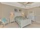 This bedroom is a relaxing retreat featuring a white-framed bed, dresser, and side tables at 13241 Scrub Jay Ct, Port Charlotte, FL 33953