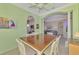 Dining area with white chairs and views through archways of the living room and kitchen at 13241 Scrub Jay Ct, Port Charlotte, FL 33953