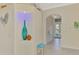 Bright foyer featuring elegant archway, decorative niche, and neutral color palette at 13241 Scrub Jay Ct, Port Charlotte, FL 33953