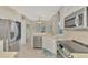 Charming kitchen features modern stainless appliances and plenty of storage space in its white cabinetry at 13241 Scrub Jay Ct, Port Charlotte, FL 33953