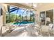 Enclosed pool area featuring a beautiful pool and outdoor seating at 13241 Scrub Jay Ct, Port Charlotte, FL 33953