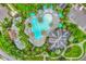 Expansive community pool with lounge seating, tiki hut, and lush landscaping at 15 Boca Royale Blvd, Englewood, FL 34223