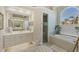 Charming bathroom with shower, tub, and dual vanity sinks at 15 Boca Royale Blvd, Englewood, FL 34223