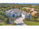 Beautiful single-story home featuring a paver driveway and lush landscaping in a desirable neighborhood at 15 Boca Royale Blvd, Englewood, FL 34223