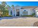 Charming home with a beautifully landscaped front yard and a welcoming entrance at 15 Boca Royale Blvd, Englewood, FL 34223