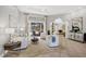 Bright and airy living room with tile flooring, neutral colors, and stylish furnishings at 15 Boca Royale Blvd, Englewood, FL 34223