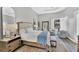 Serene main bedroom with sitting area, neutral tones, and ample natural light at 15 Boca Royale Blvd, Englewood, FL 34223