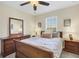 Bedroom featuring wood furniture, a large window and neutral decor at 15081 Aldama Cir, Port Charlotte, FL 33981