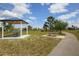 Community park featuring picnic tables, open green space, and a paved walking path at 15081 Aldama Cir, Port Charlotte, FL 33981