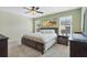Serene bedroom with a king-sized bed, soft lighting, and calming decor, providing a peaceful retreat at 15081 Aldama Cir, Port Charlotte, FL 33981