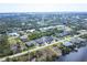 Aerial view of residential neighborhood with water access at 15081 Aldama Cir, Port Charlotte, FL 33981