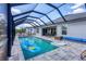 Inviting screened-in pool featuring playful floats and a comfortable seating area, perfect for relaxation and enjoyment at 15081 Aldama Cir, Port Charlotte, FL 33981