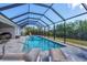 Screened-in pool area with a pool and outdoor seating for a relaxing backyard oasis at 15081 Aldama Cir, Port Charlotte, FL 33981