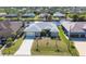 Aerial view of a waterfront home boasting a boat dock and beautiful canal access at 15610 Seafoam Cir, Port Charlotte, FL 33981