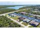 Picturesque aerial shot of waterfront homes with boat docks, offering direct access to the ocean and surrounding waterways at 15610 Seafoam Cir, Port Charlotte, FL 33981