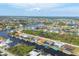 Aerial view of the neighborhood showcasing waterfront homes and canals at 15610 Seafoam Cir, Port Charlotte, FL 33981