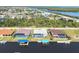 Aerial view of the houses showing the pools, docks and landscaping at 15610 Seafoam Cir, Port Charlotte, FL 33981
