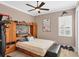 Bedroom features a built-in headboard, nautical decor, and a window with plantation shutters at 15610 Seafoam Cir, Port Charlotte, FL 33981