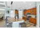 Bright kitchen with a large island with bar seating, stainless appliances, and light-colored countertops at 15610 Seafoam Cir, Port Charlotte, FL 33981