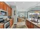 Open concept kitchen with granite countertops, stainless steel appliances, and views of the Gathering room at 15610 Seafoam Cir, Port Charlotte, FL 33981