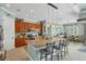 Spacious eat-in kitchen featuring an oversized island, granite countertops, and stainless steel appliances at 15610 Seafoam Cir, Port Charlotte, FL 33981