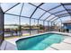 Screened pool featuring a covered enclosure and beautiful waterfront views at 15610 Seafoam Cir, Port Charlotte, FL 33981