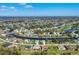 Expansive aerial view of a community with canals, lakes and beautiful homes at 170 Long Meadow Ln, Rotonda West, FL 33947